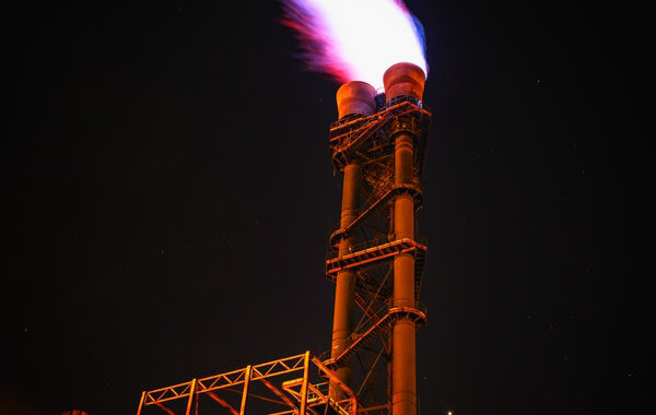 Image of a gas plant smokestack letting out fire